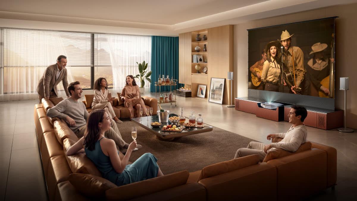 AWOL Vision large-screen living room with a family viewing a movie or sports event