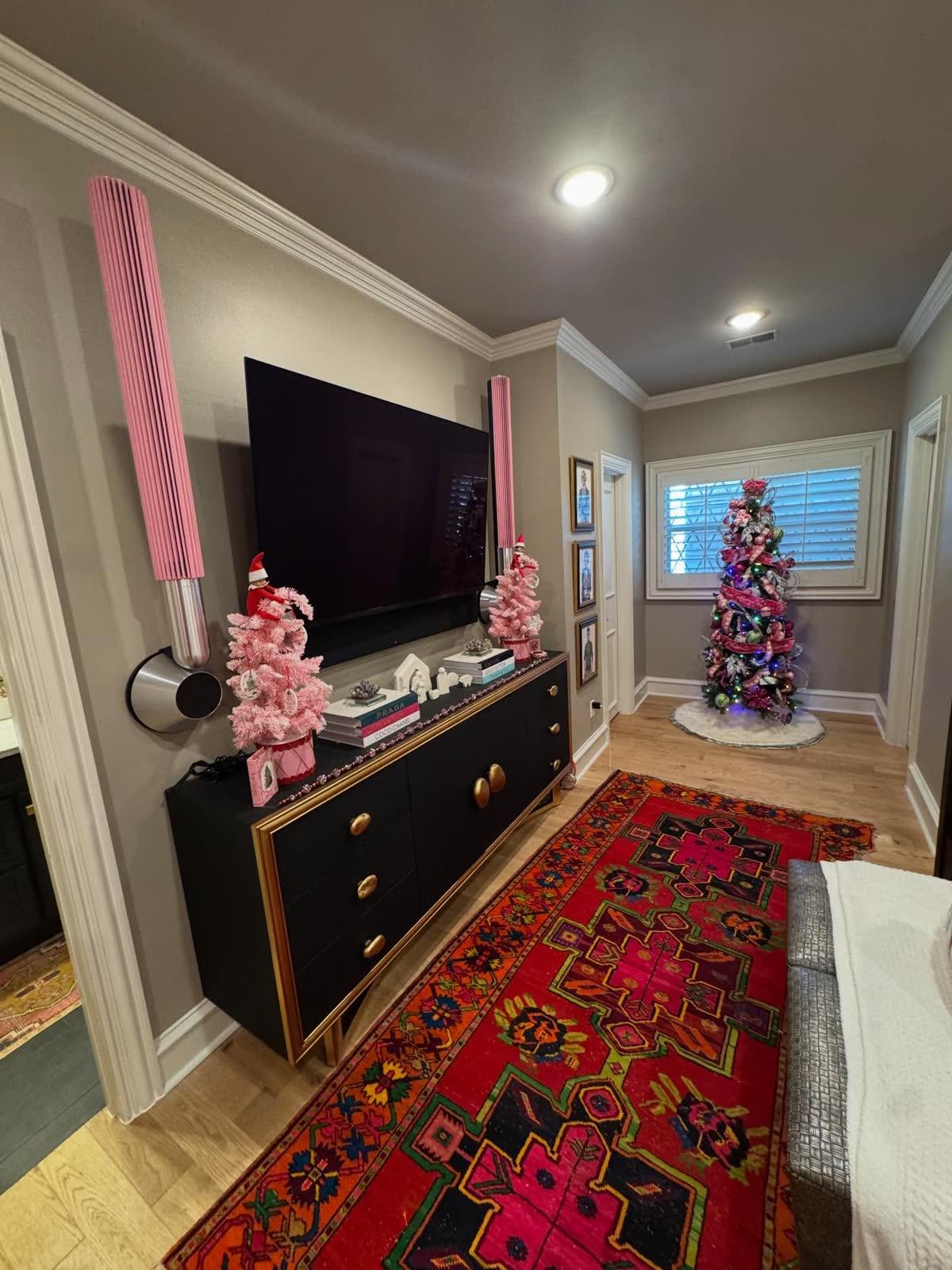 HomeTroniX Bang and Olufsen Beolab 28 speaker installation flanking a wall-mounted television in a Jonesboro AR home