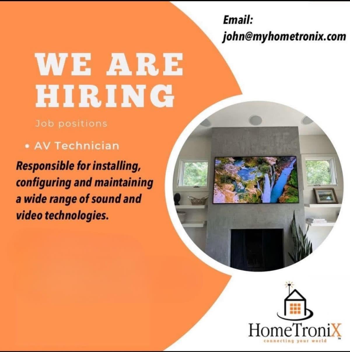 HomeTroniX media room with custom art wall installation showing integrated audio-video design in a Jonesboro AR residence