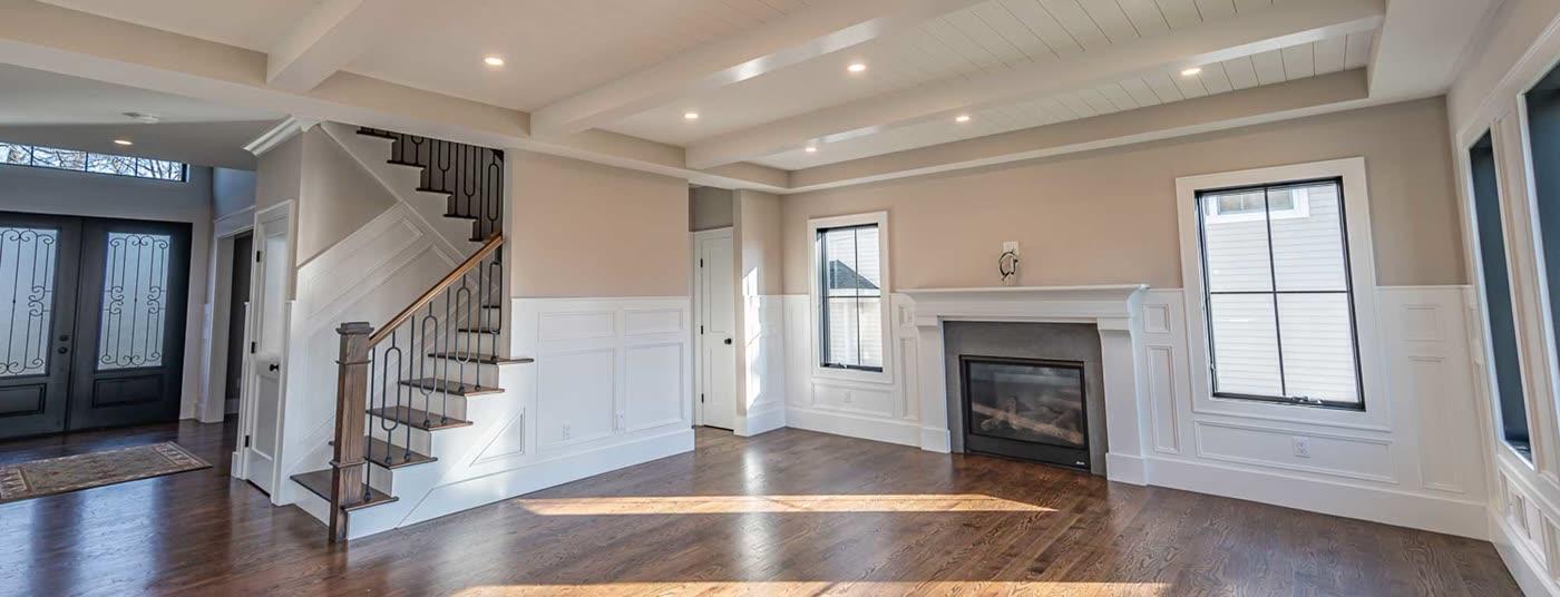 Prominent Builders open family room with fireplace in a new construction addition