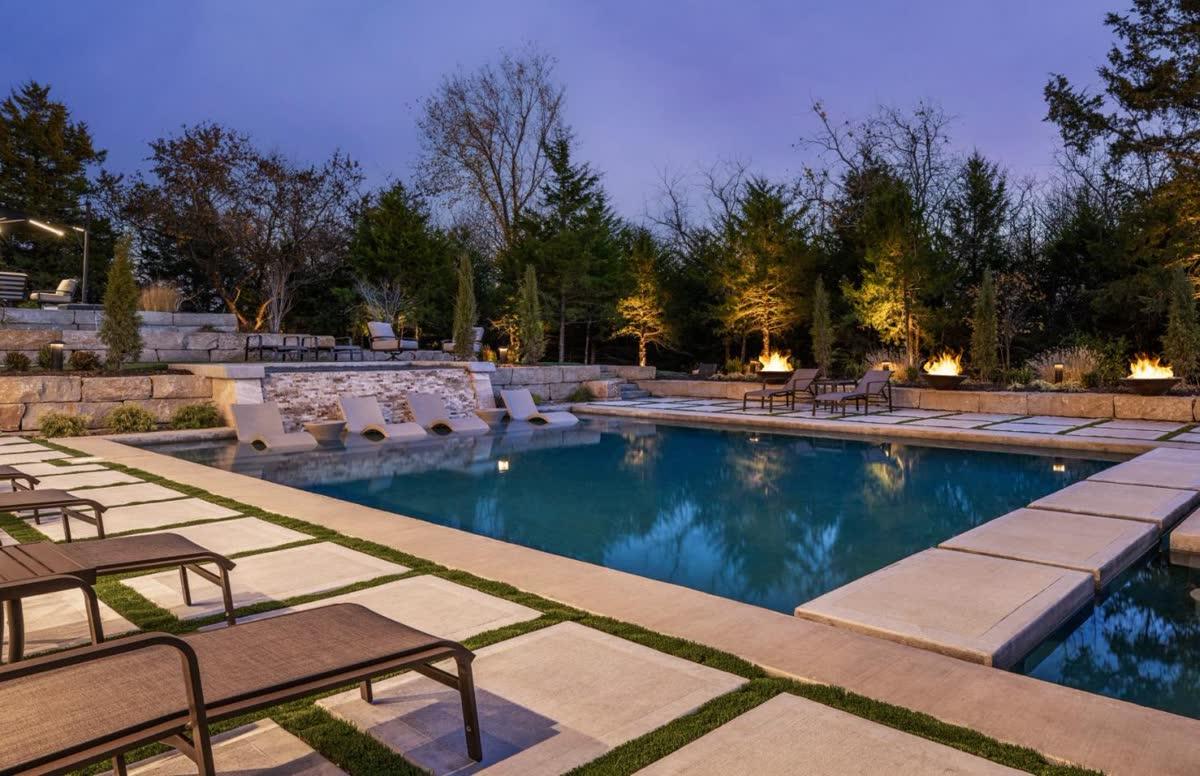 Simplicity KC pool area with automated landscape lighting and outdoor audio integration